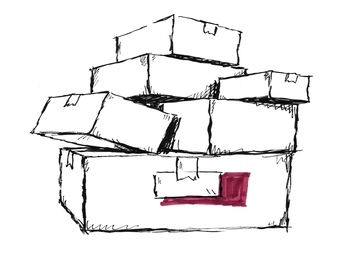 A stack of cardboard moving boxes, one with a forwarding address label.
