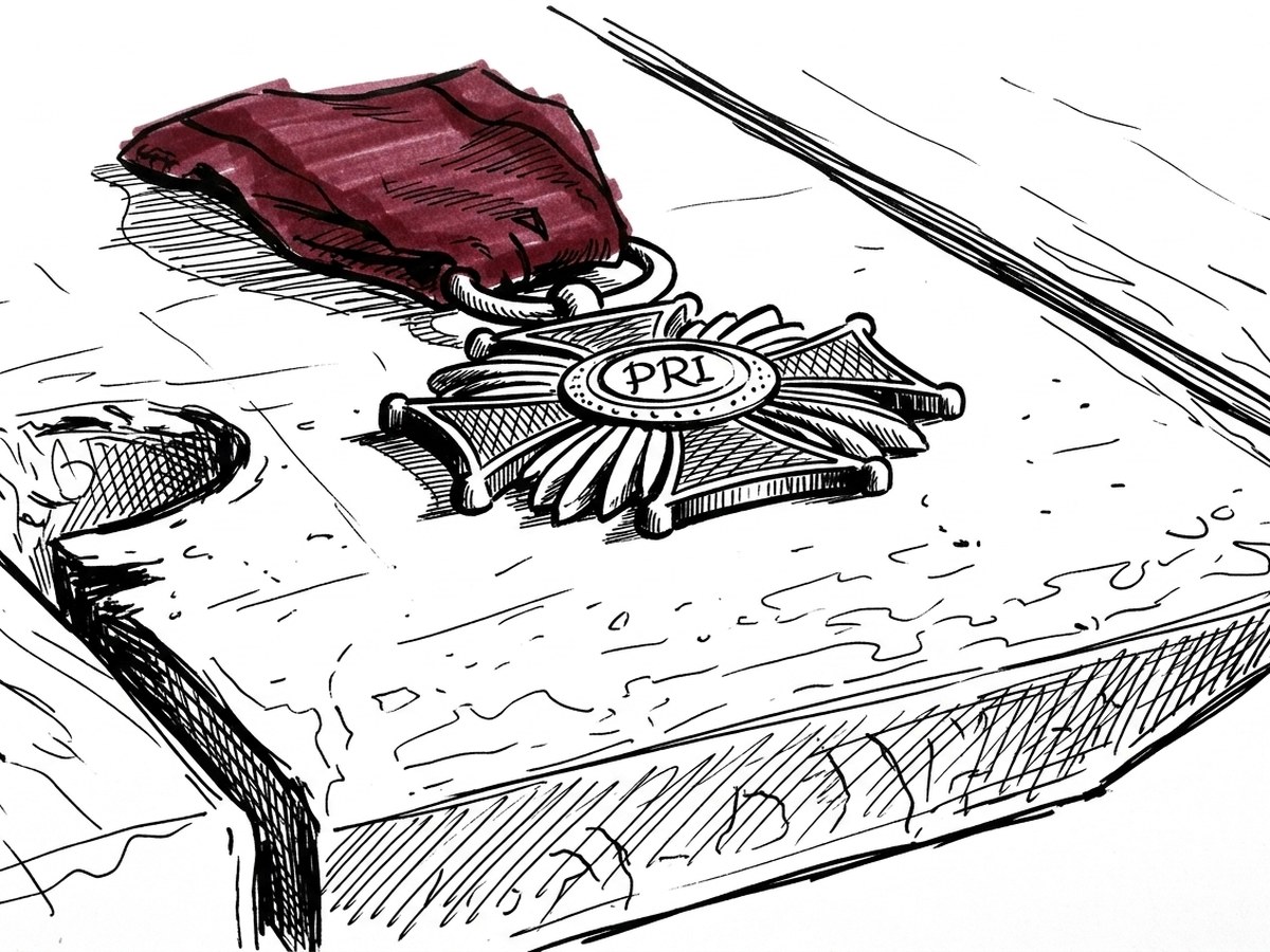 An old medal on a ribbon lying on a padded presentation case.