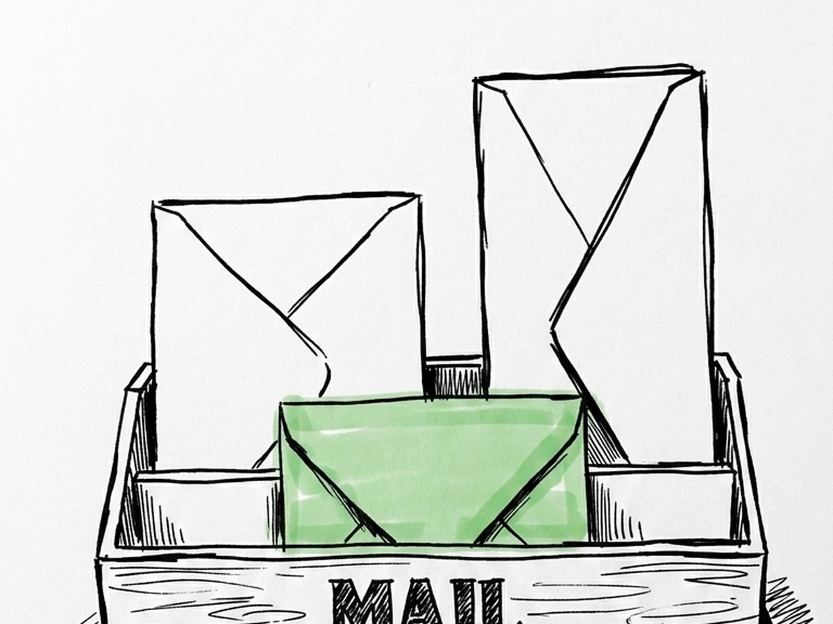 Envelopes standing in a desk mail tray.
