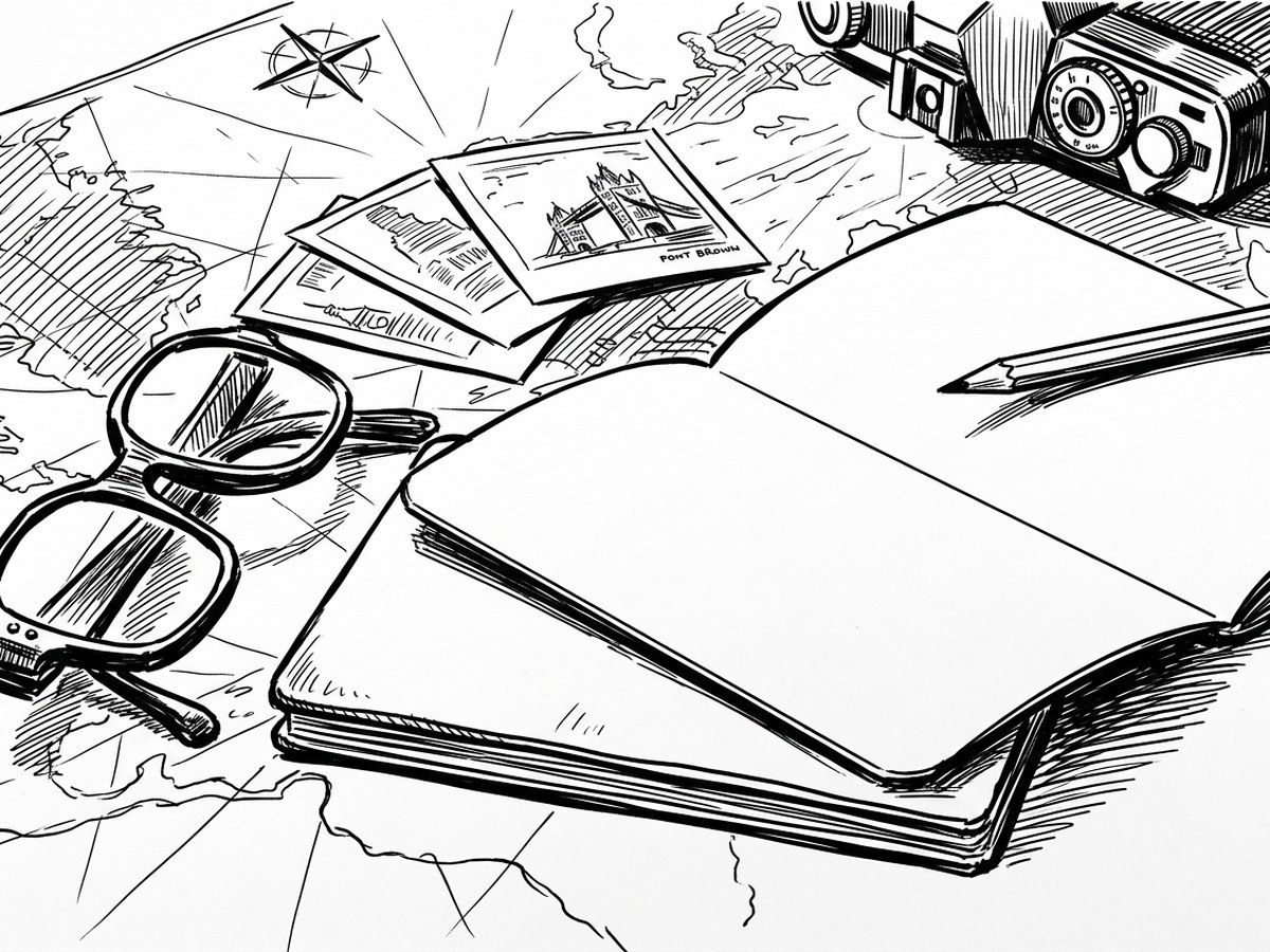 An open notebook with photographs, reading glasses and a pencil laid beside it.