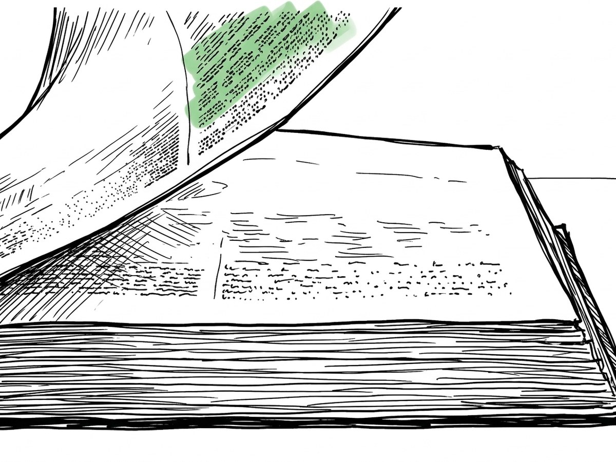 An open manual lying flat, one heading marked in the margin.